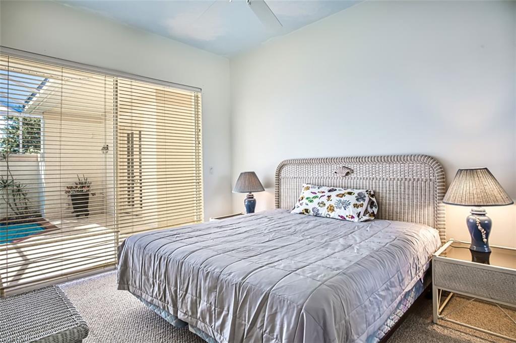 Bedroom featuring carpet flooring and ceiling fan
