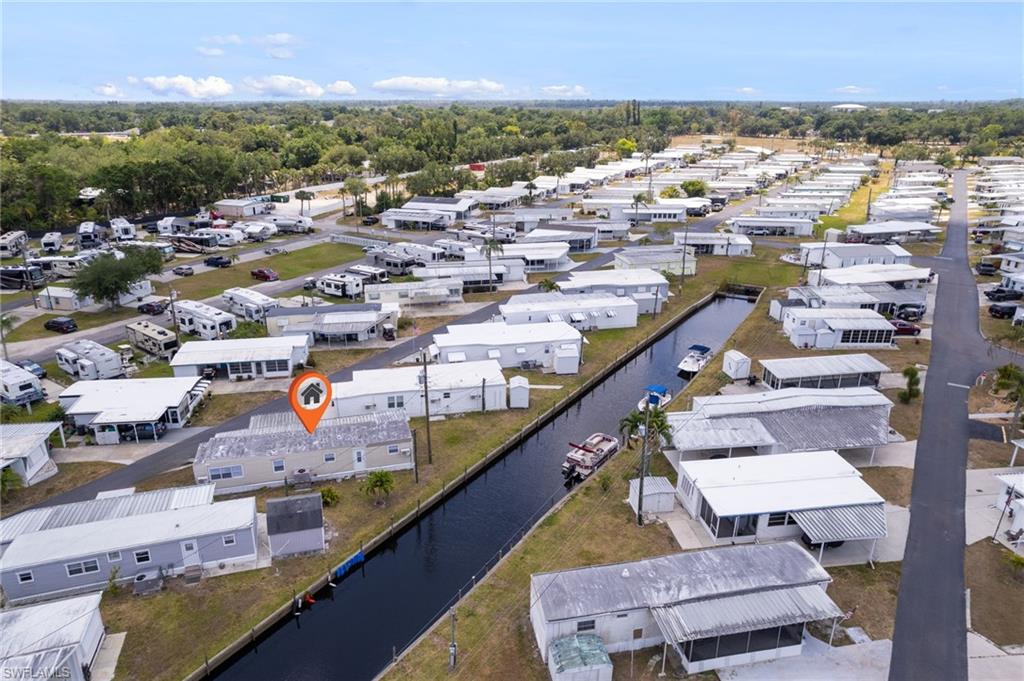 Aerial view with a water view and a residential view