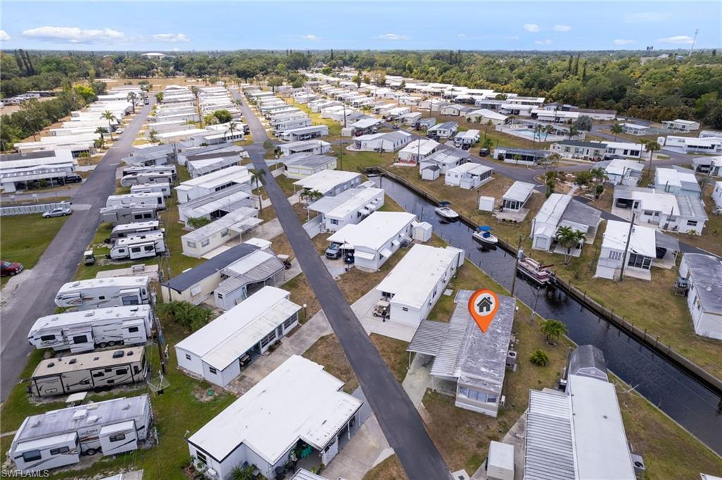 Drone / aerial view featuring a water view and a residential view