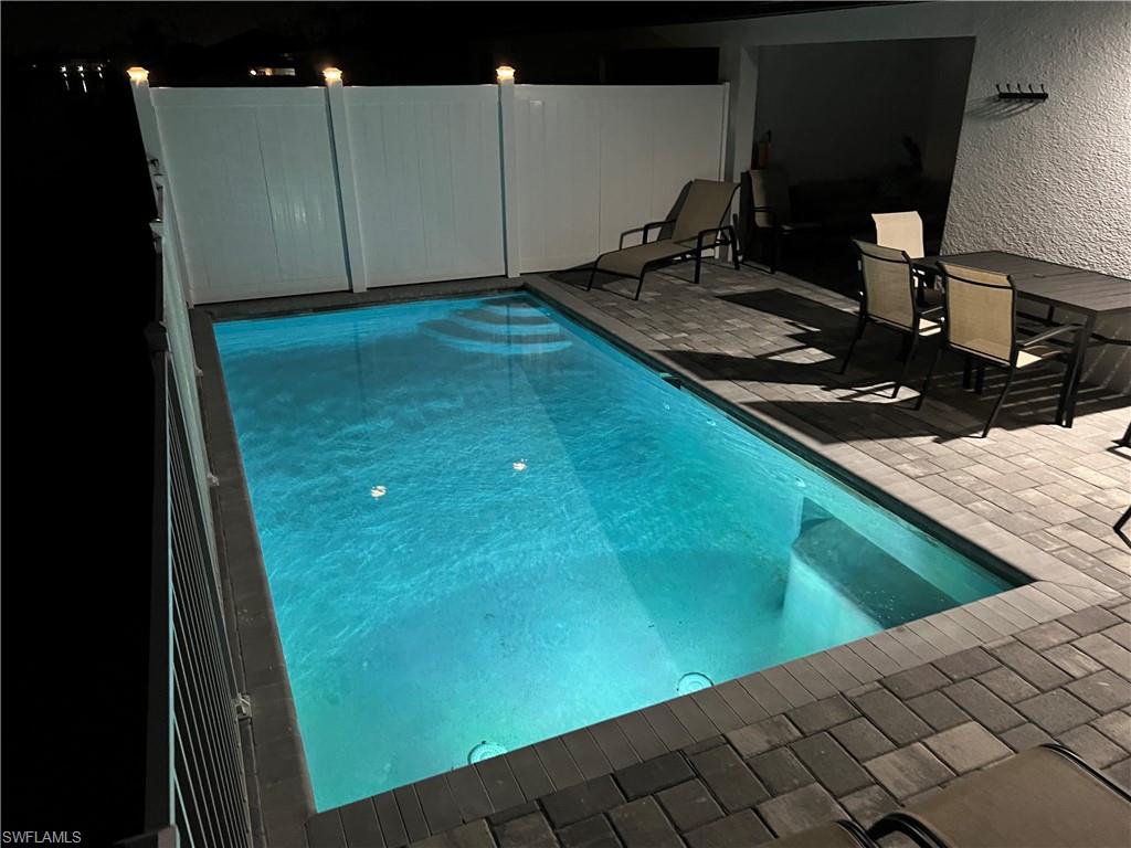 View of pool at twilight