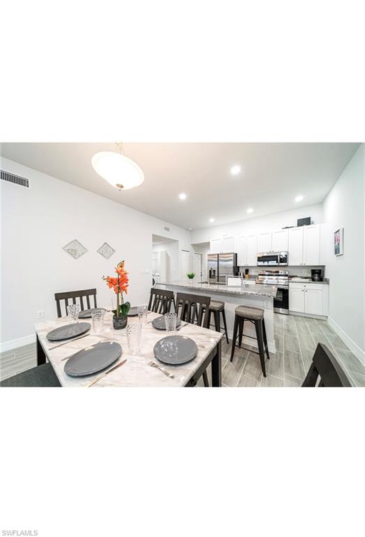Dining area featuring light hardwood / wood-style floors