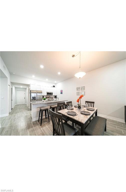 Dining area featuring light hardwood / wood-style flooring