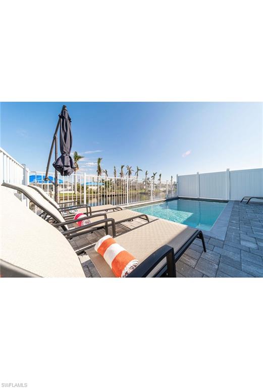 View of swimming pool with a patio