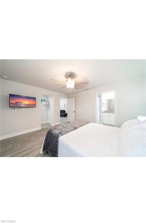 Bedroom with hardwood / wood-style flooring and ceiling fan
