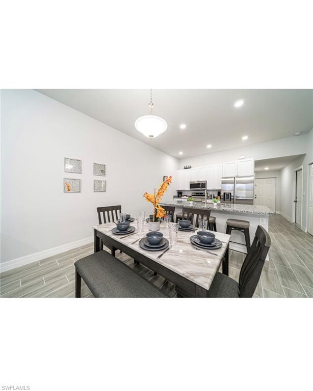 Dining space featuring light hardwood / wood-style flooring