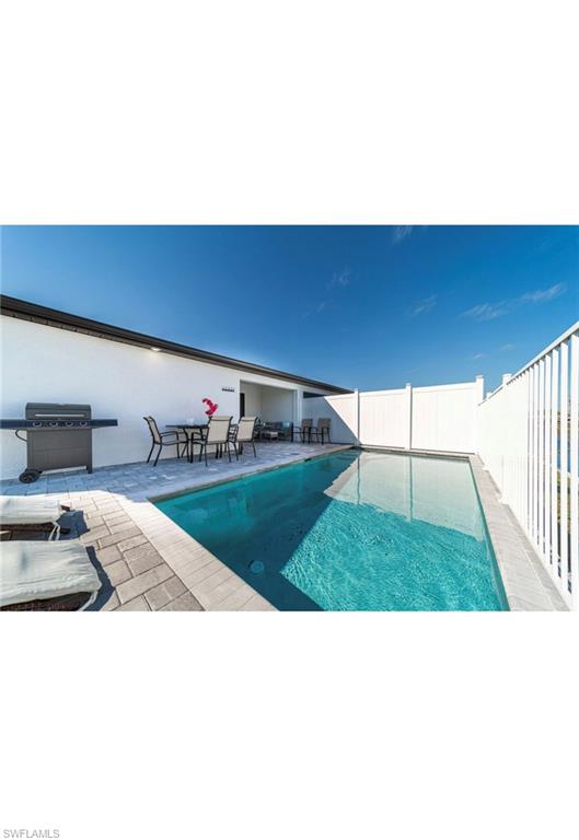 View of pool with a patio area
