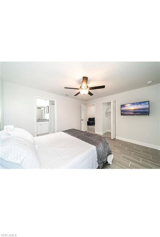 Bedroom featuring ceiling fan and wood-type flooring