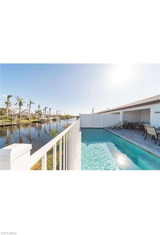 View of pool featuring a water view