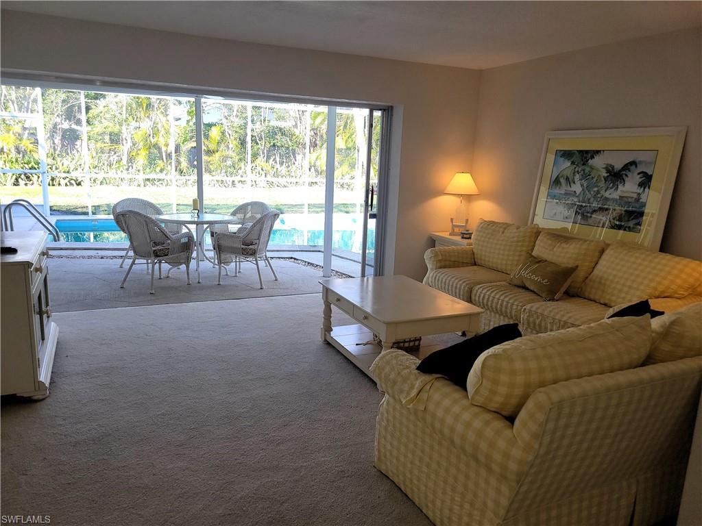 Living room featuring carpet flooring