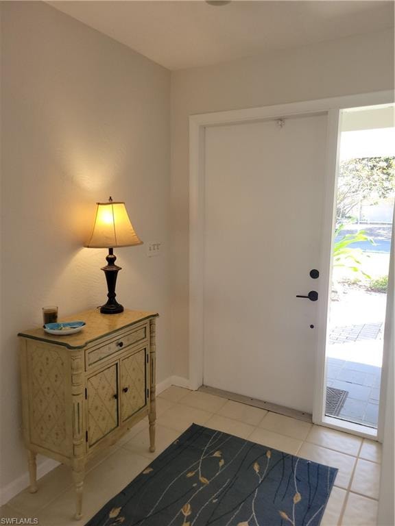 Entryway featuring light tile patterned flooring