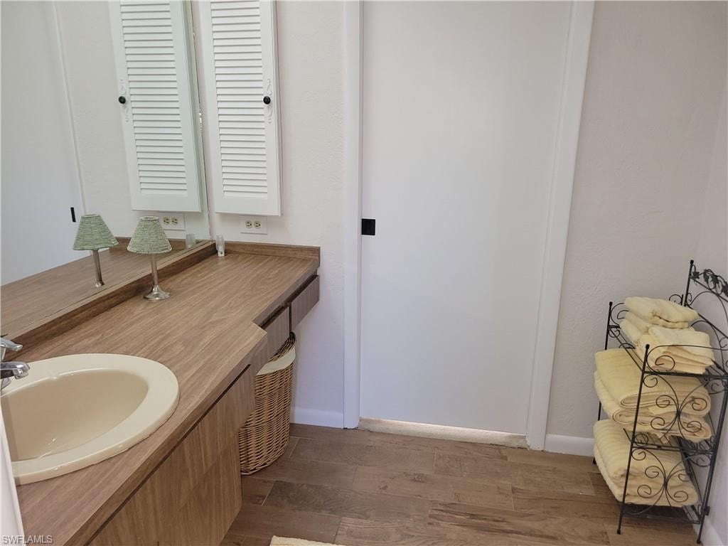 Bathroom featuring wood-type flooring and vanity