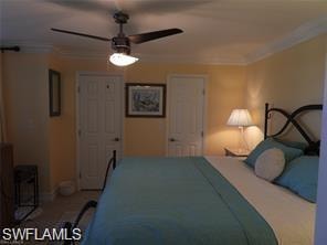 Bedroom with crown molding and ceiling fan