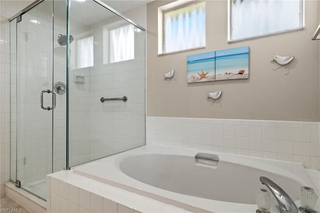 Bathroom featuring plus walk in shower