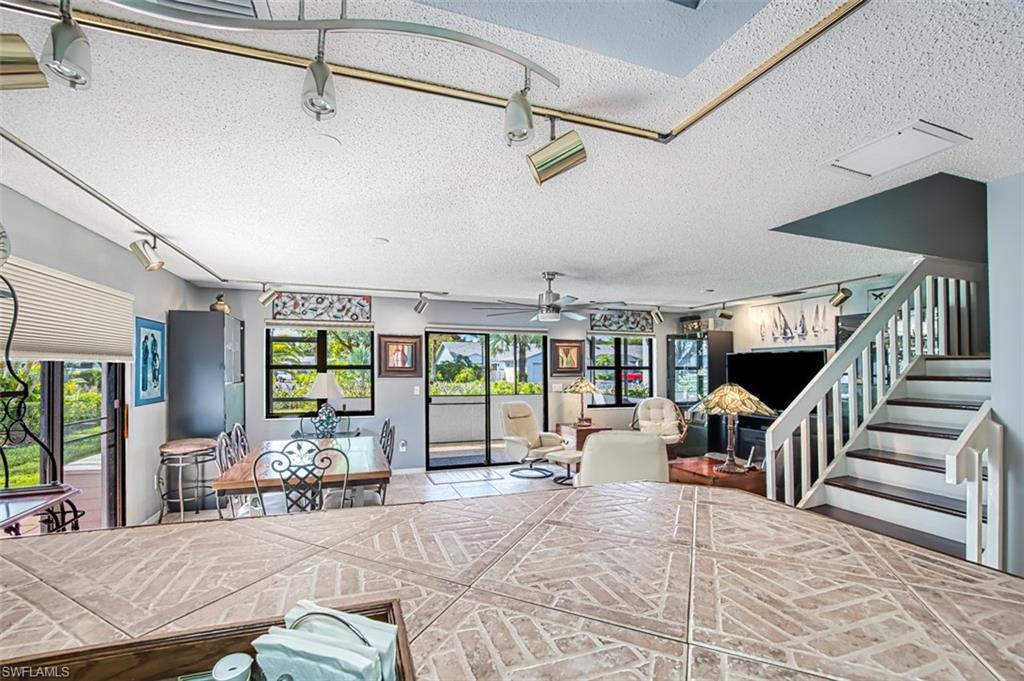 View from kitchen into the dining/living area.  Abundance of natural lighting.