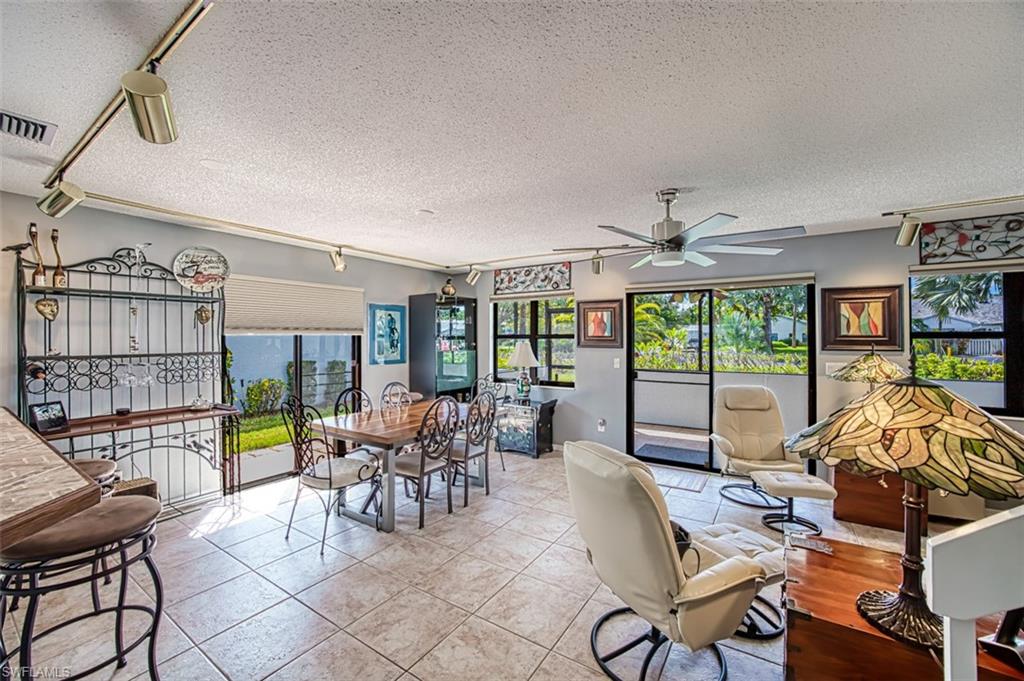 Dining area with sliders that exit to spacious lanai and side of the home