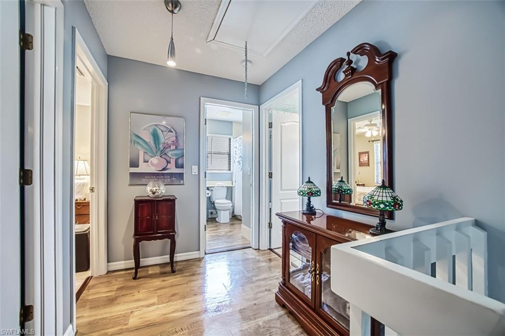 Landing on second floor.  Primary bedroom to right and two guest rooms to left.