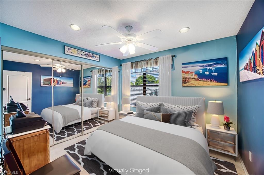 Bedroom featuring a closet, ceiling fan, and a textured ceiling