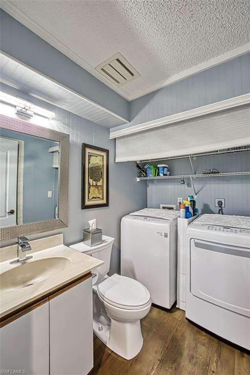 1st floor bathroom with shower and laundry room area.
