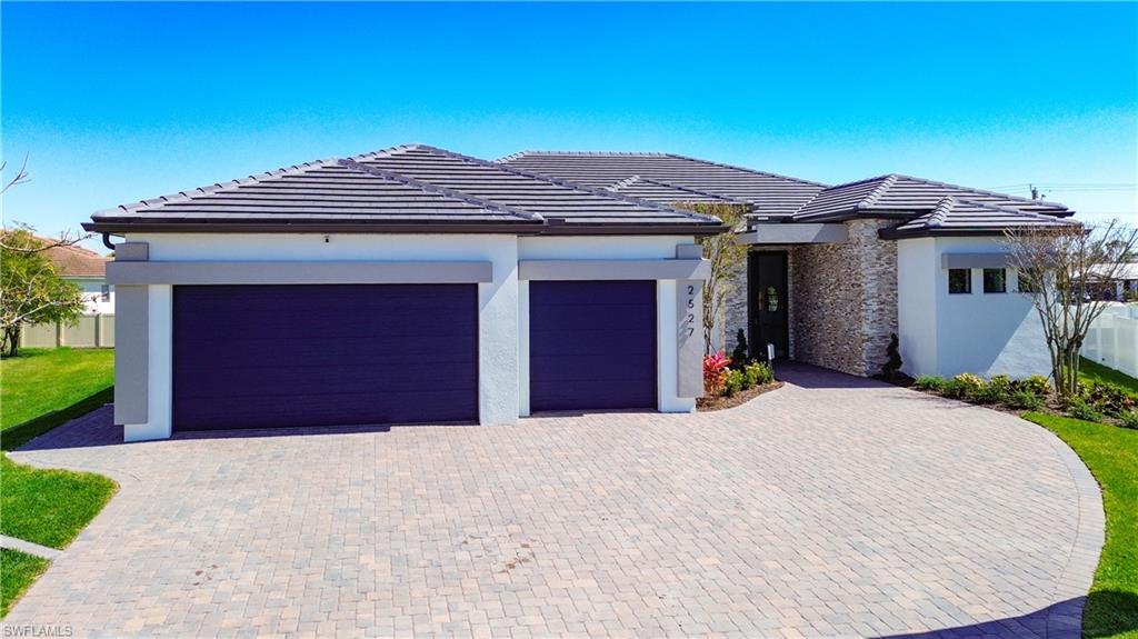View of front of property with a garage