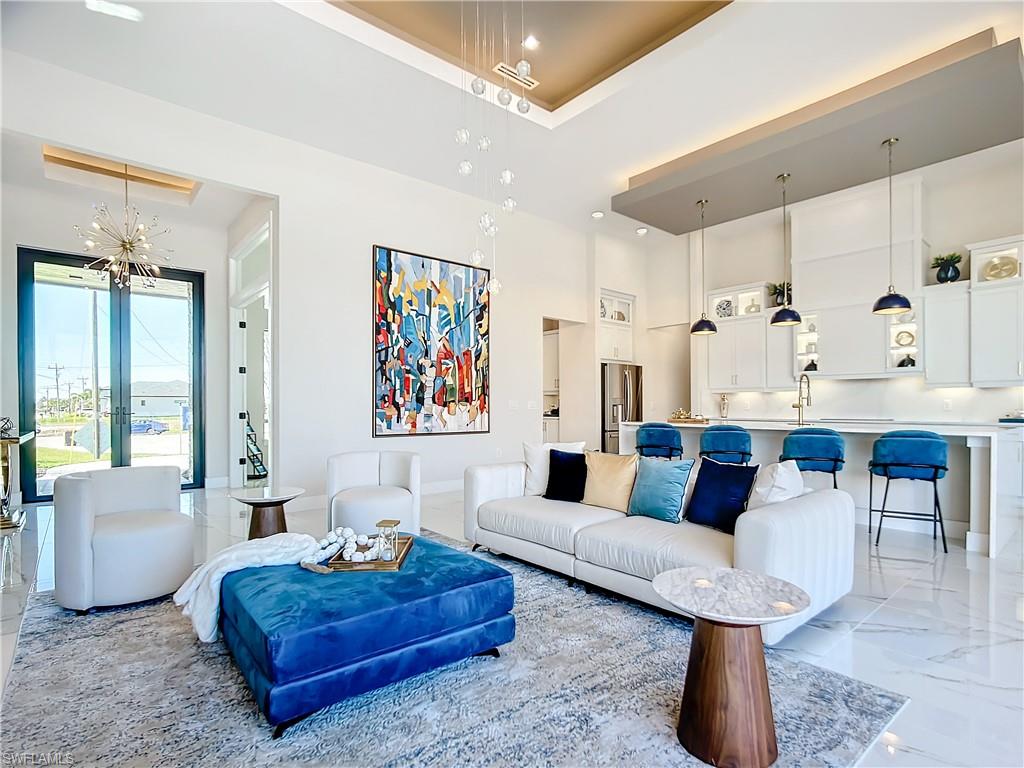 Living room with a towering ceiling and sink
