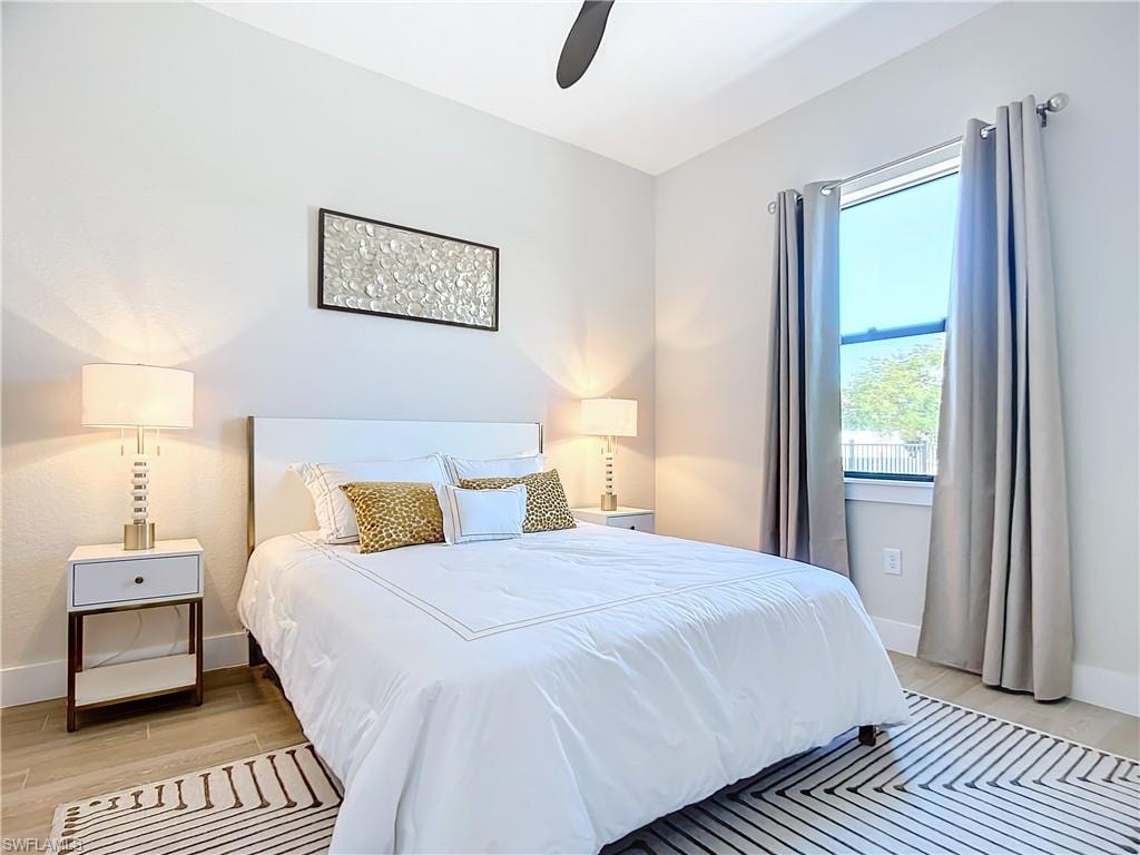 Bedroom featuring light hardwood / wood-style floors and ceiling fan