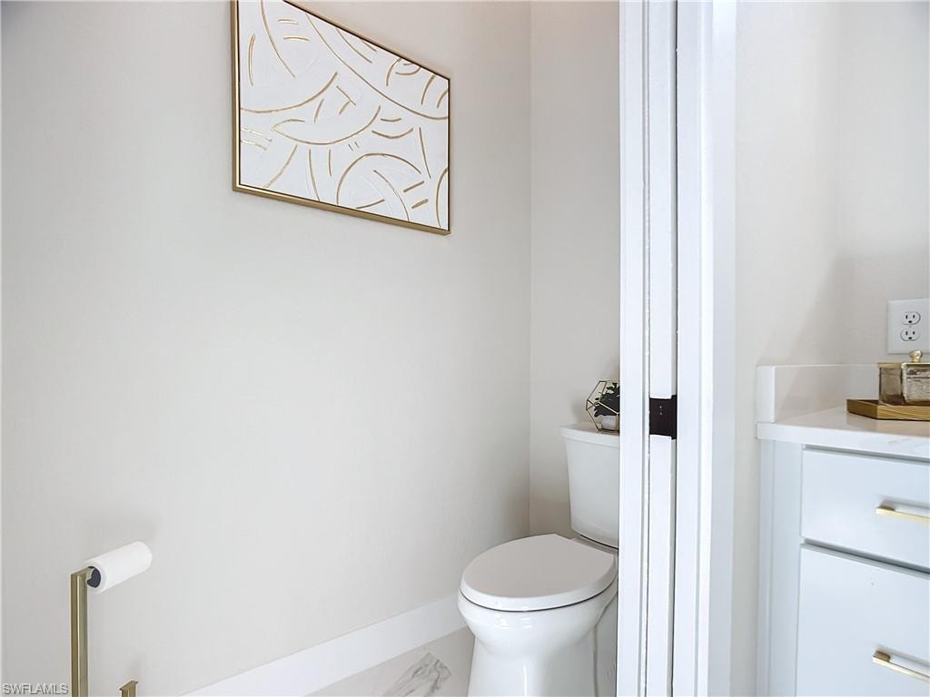 Bathroom featuring vanity and toilet