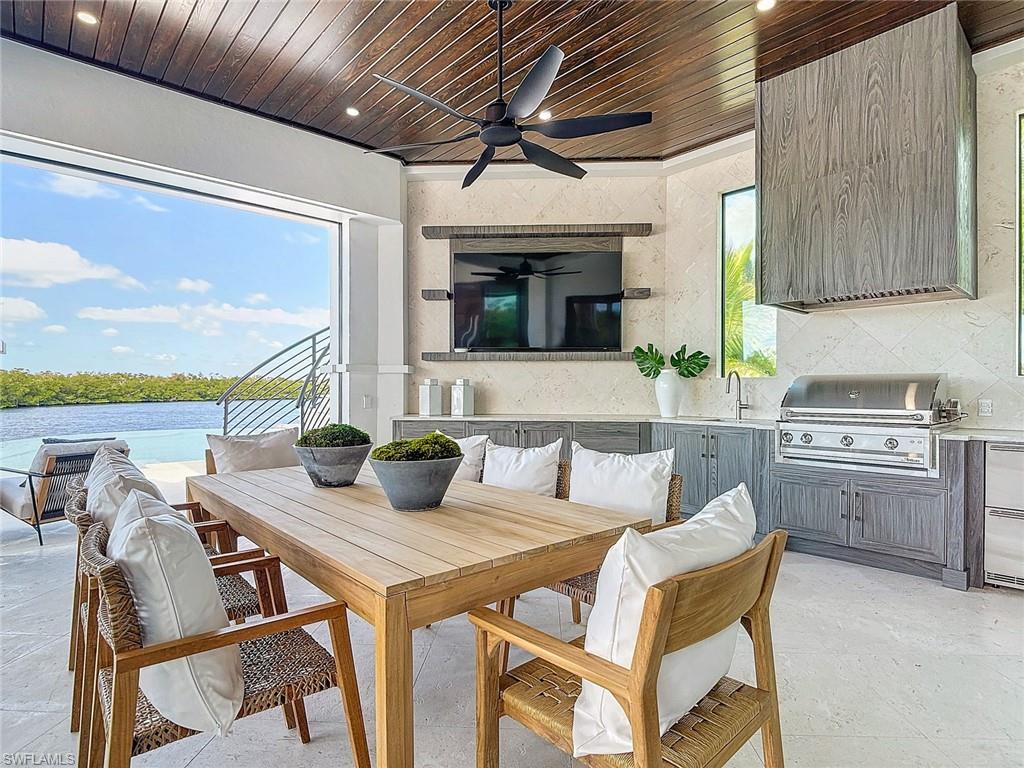 Enjoy entertaining in the summer kitchen with built in gas grill.