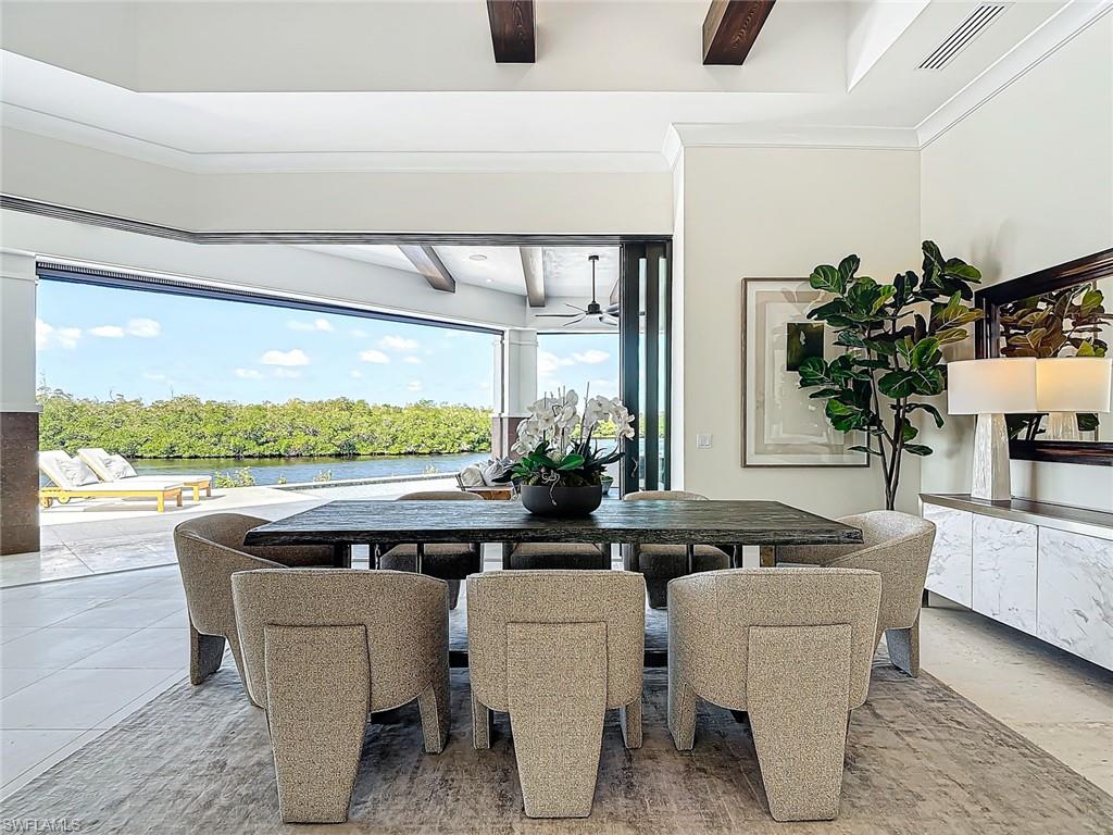 The dining area in the great room has a beautiful view of the wide canal.