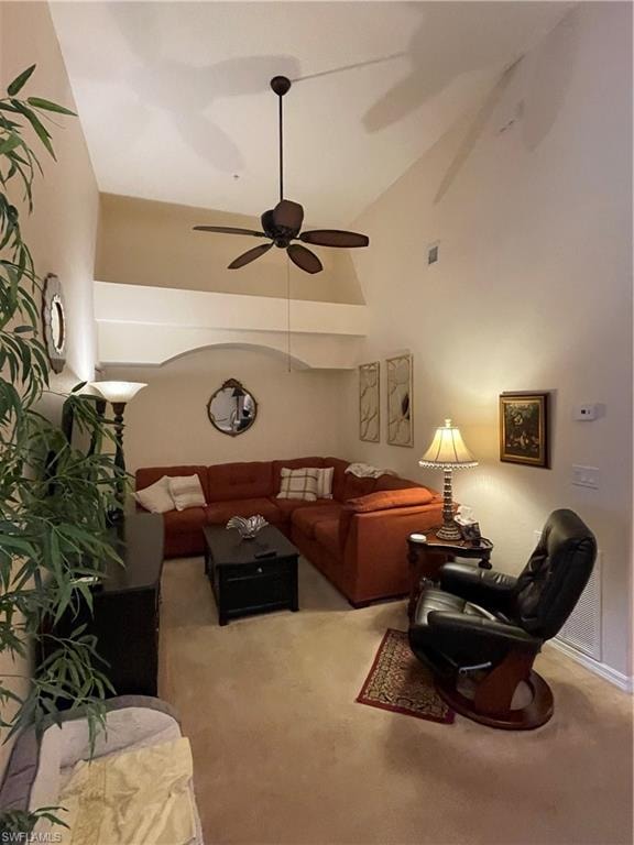 Carpeted Den with vaulted ceiling and ceiling fan