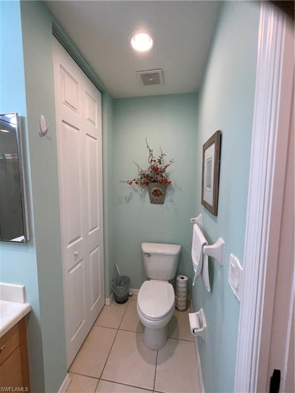 Master Bathroom featuring vanity, toilet, and tile patterned flooring
