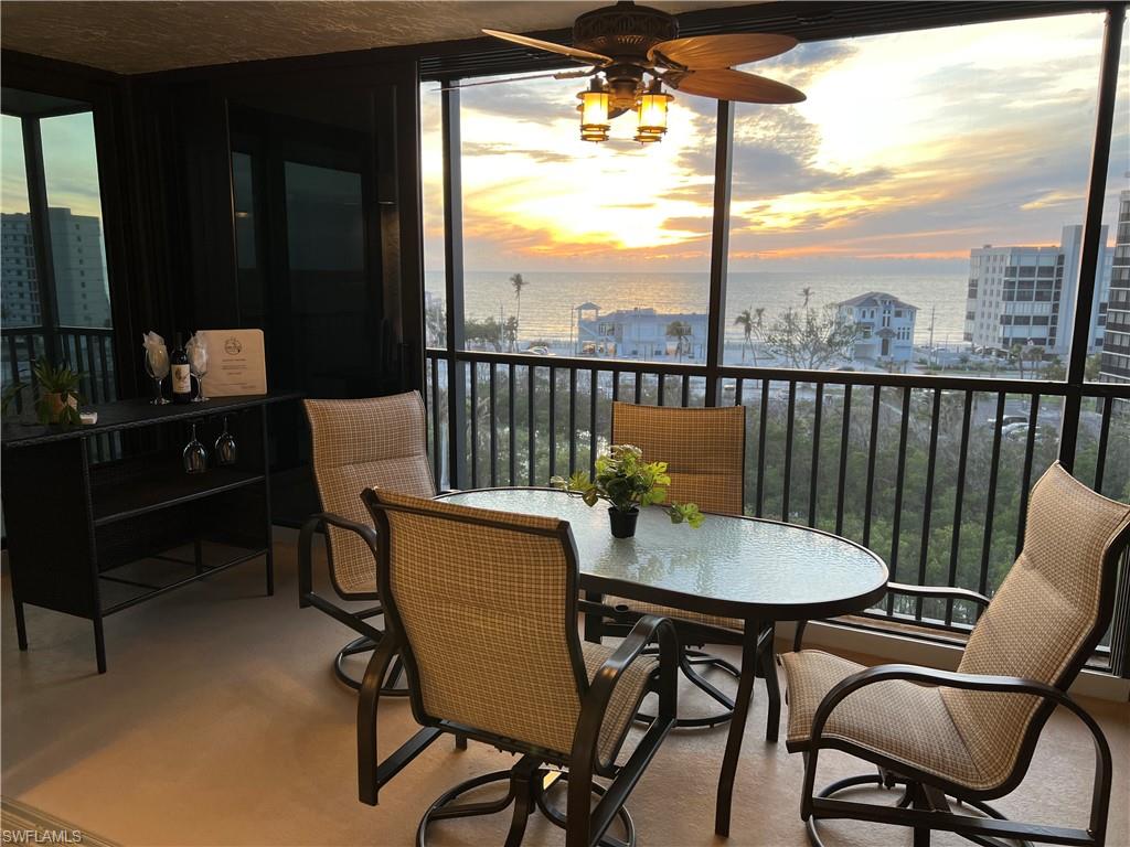 Sunroom with a water view, a healthy amount of sunlight, and ceiling fan