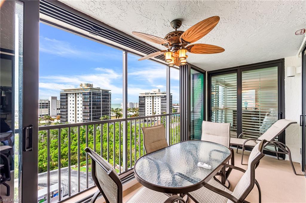 Sunroom / solarium featuring ceiling fan
