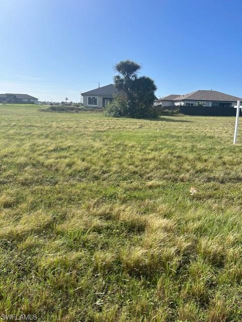 View of yard with a rural view