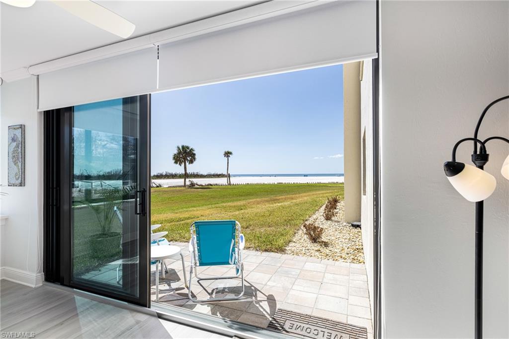 Entryway featuring a water view, hardwood / wood-style flooring, and plenty of natural light