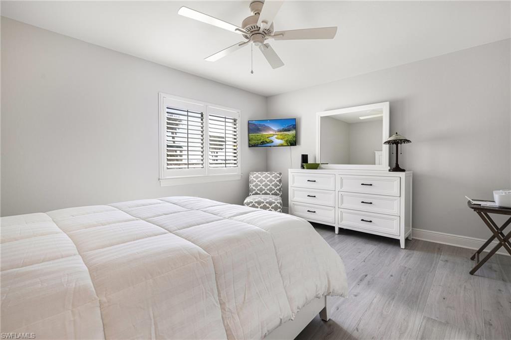 Bedroom featuring light hardwood / wood-style flooring and ceiling fan