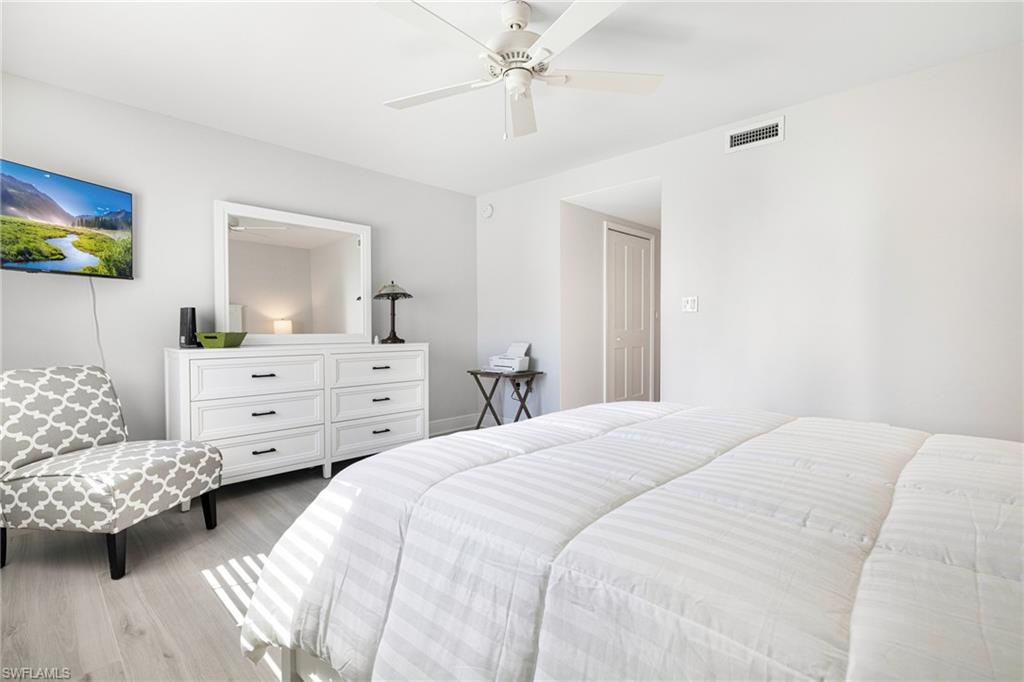 Bedroom featuring light hardwood / wood-style floors and ceiling fan