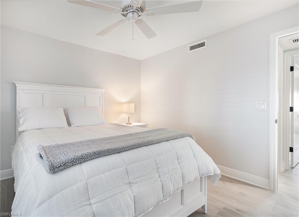 Bedroom featuring light hardwood / wood-style flooring and ceiling fan