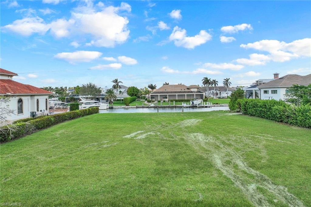 View of yard with a water view