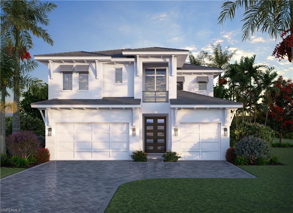 View of front of home with a garage and a front yard