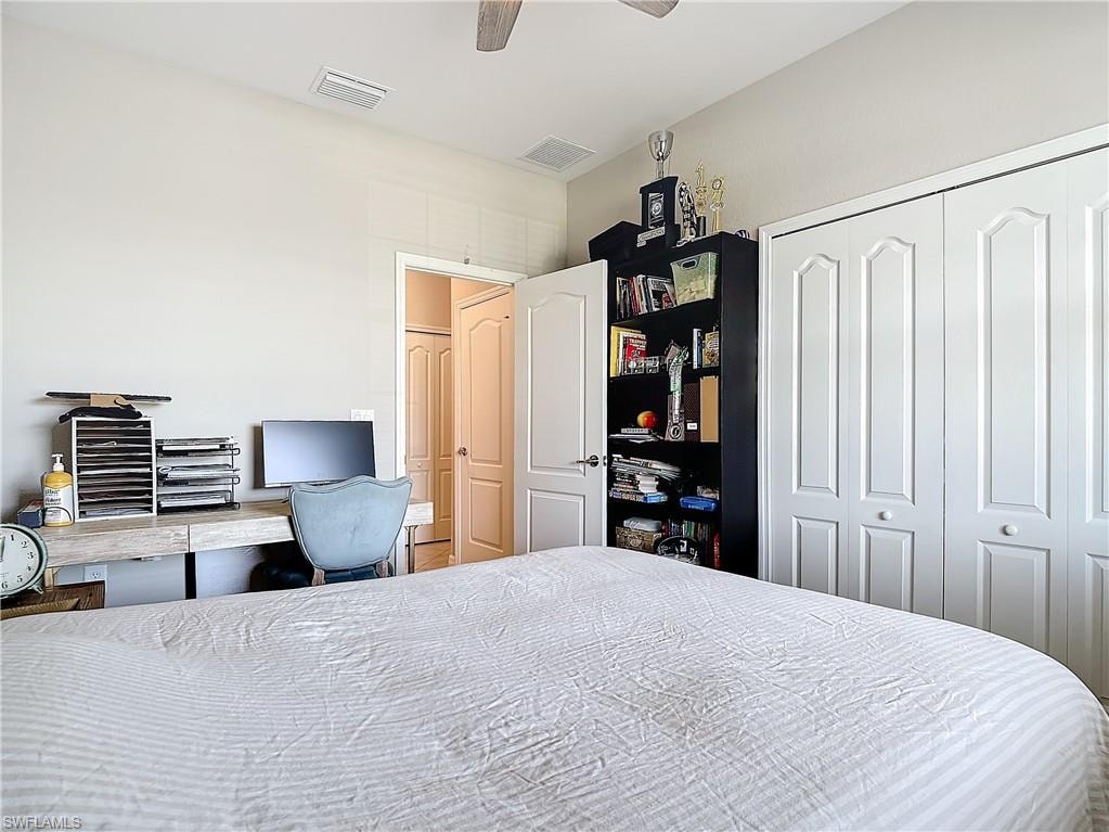 Bedroom featuring ceiling fan and a closet
