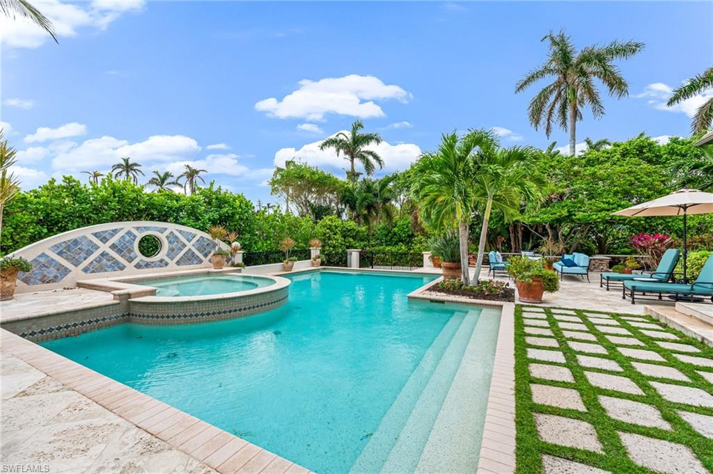 View of pool featuring an in ground hot tub and a patio