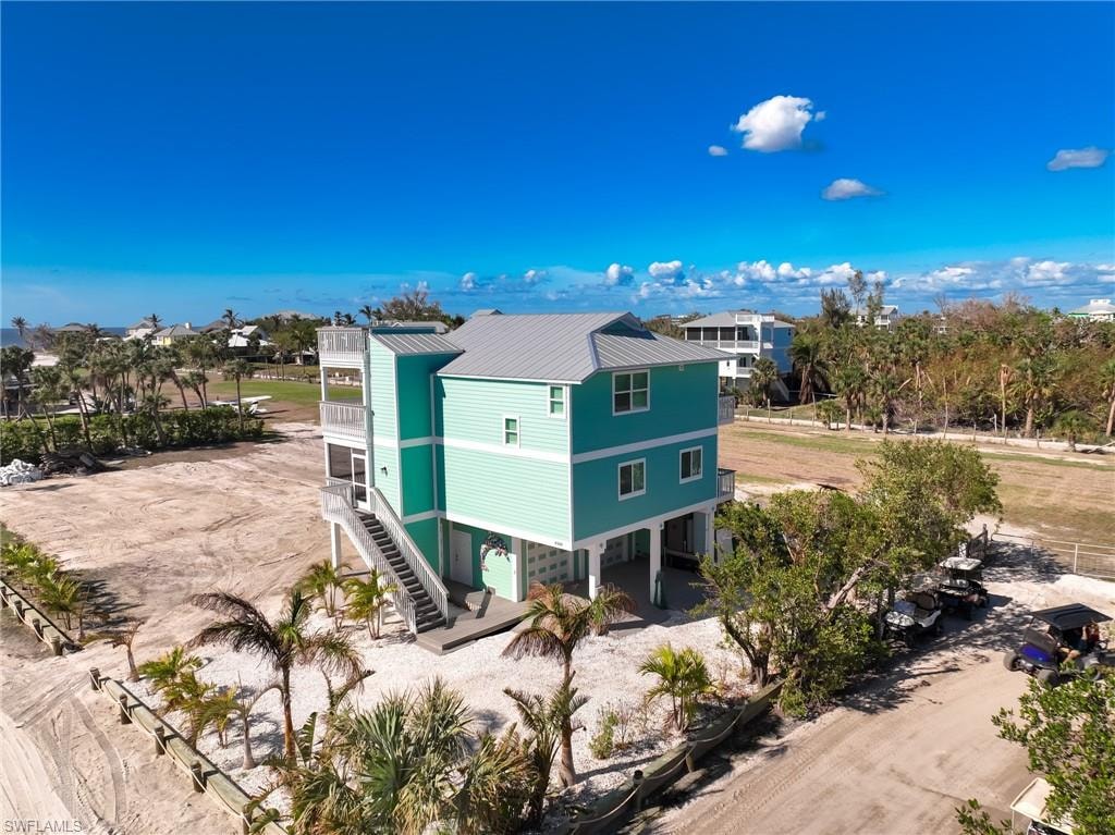 Back of property with a balcony