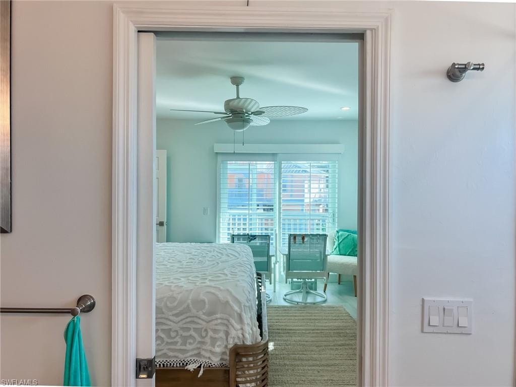 Laundry room featuring washer and clothes dryer, cabinets, water heater, and light tile patterned flooring