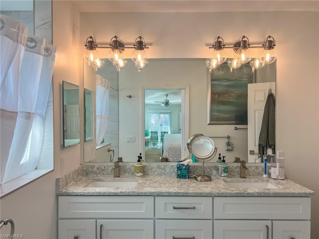 Bedroom with ensuite bathroom and ceiling fan