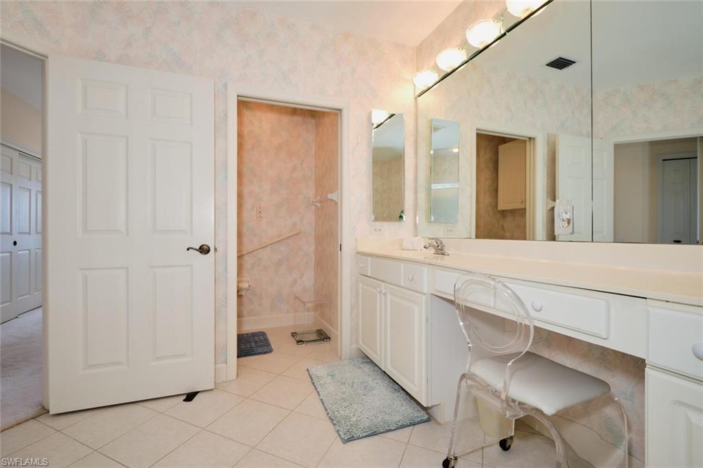 Bathroom with vanity and tile patterned floors