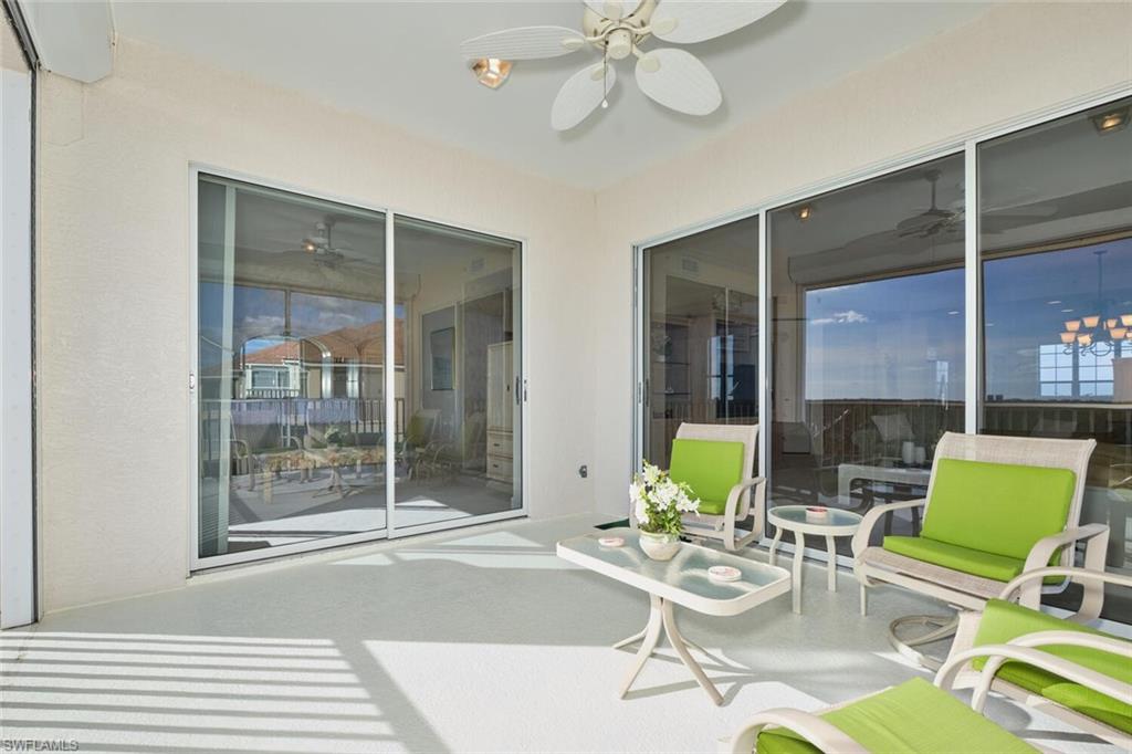 Sunroom featuring ceiling fan