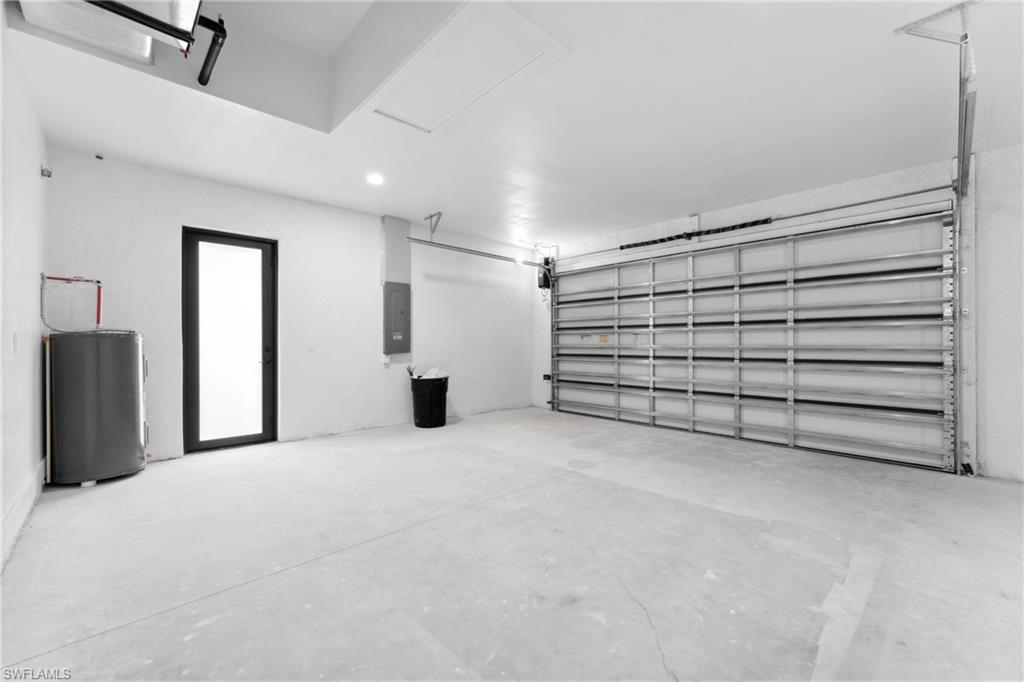 Garage with electric panel and electric water heater