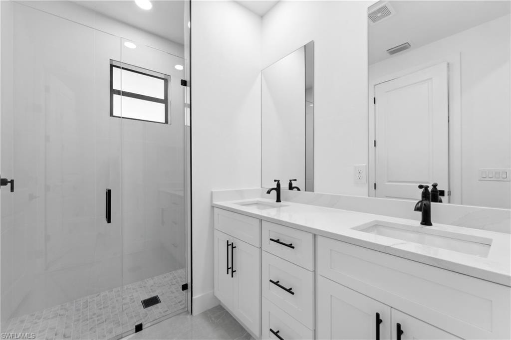 Bathroom featuring vanity and walk in shower