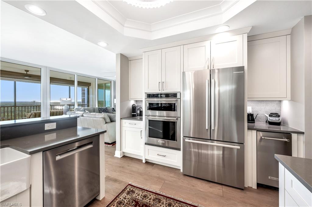 Kitchen with white cabinetry and stainless steel appliances