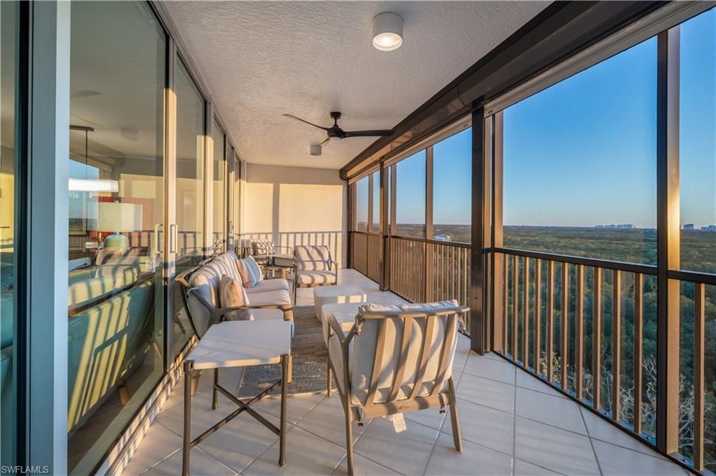 Sunroom featuring ceiling fan